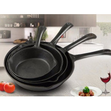 Metal frying pan with vegetable oil coating